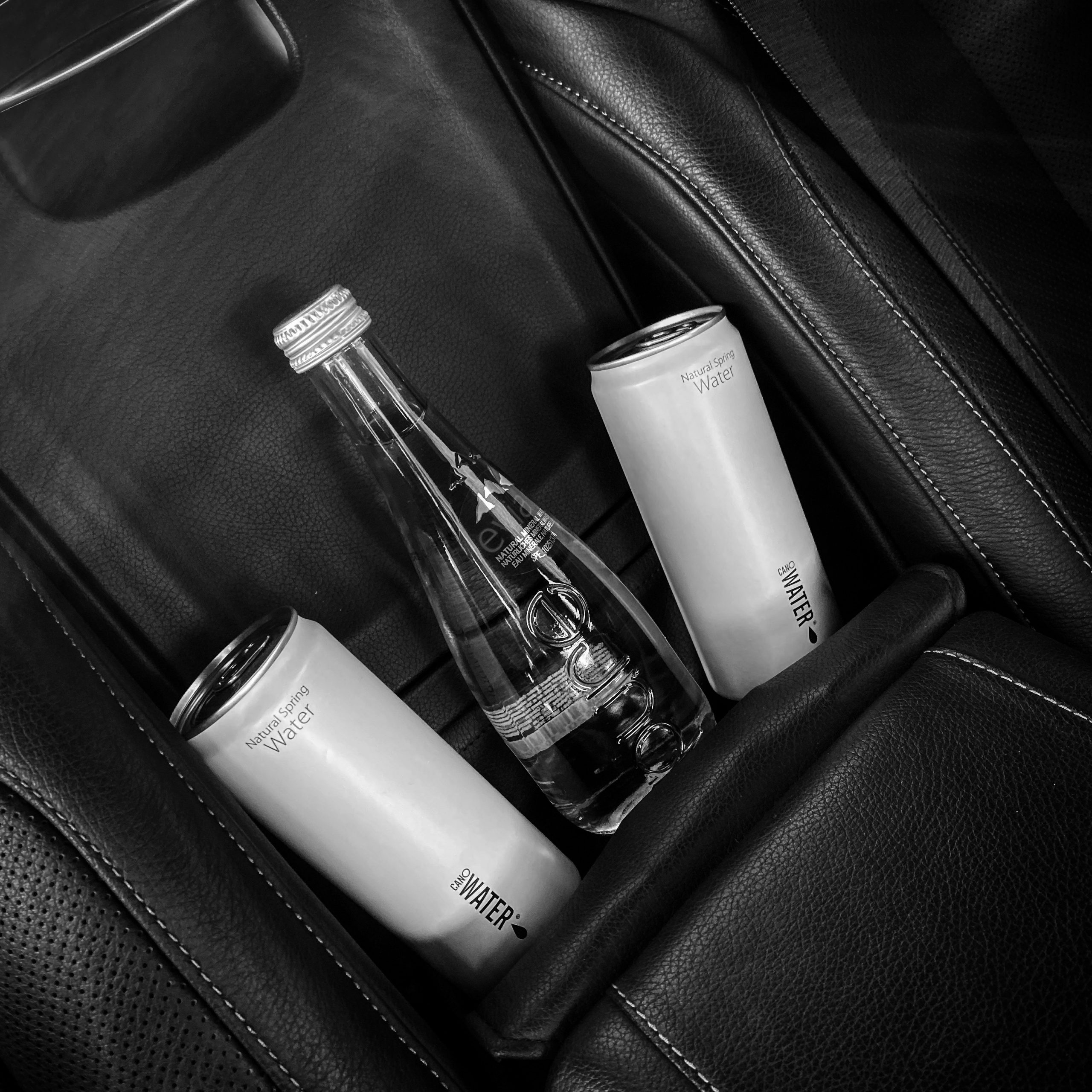 Premium Evian and Canowater for staying hydrated on chauffeured travel 